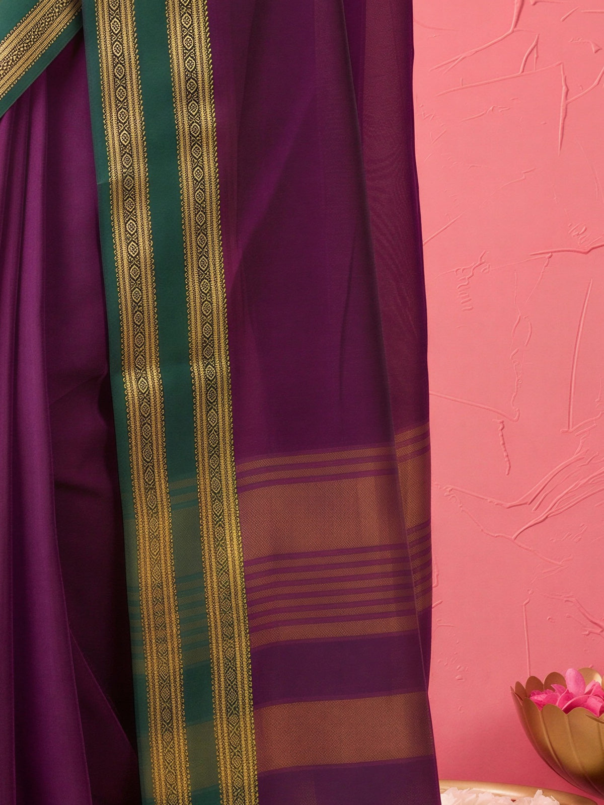 Pallu detail of wine cotton blend saree showing clean solid-tone finish and zari border