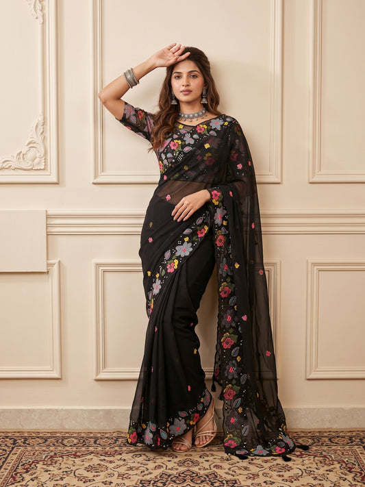 Woman wearing black georgette saree with embroidered motif work and black blouse