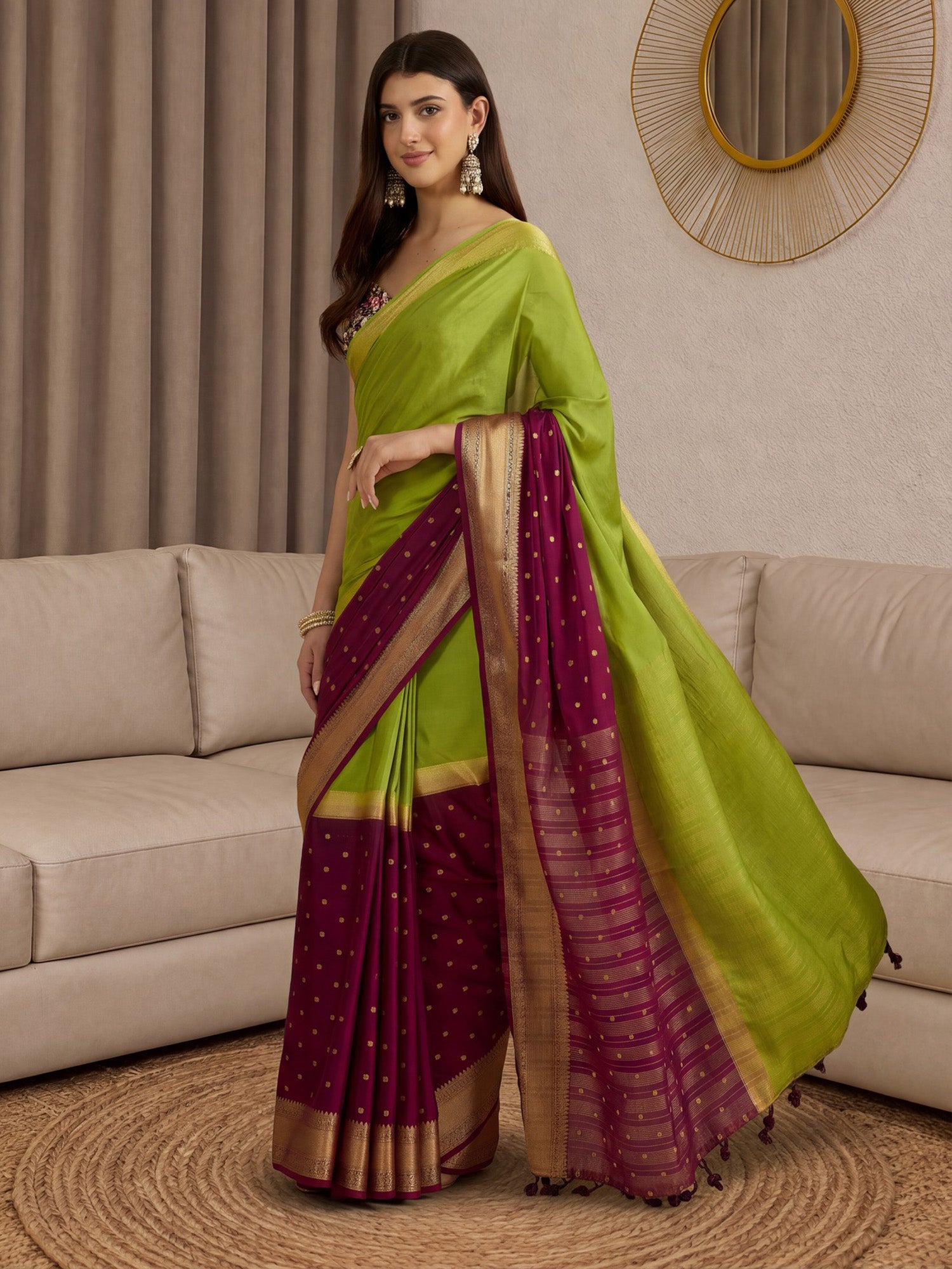 Woman wearing light green mysore silk saree with zari butta (metallic motif) work and black blouse