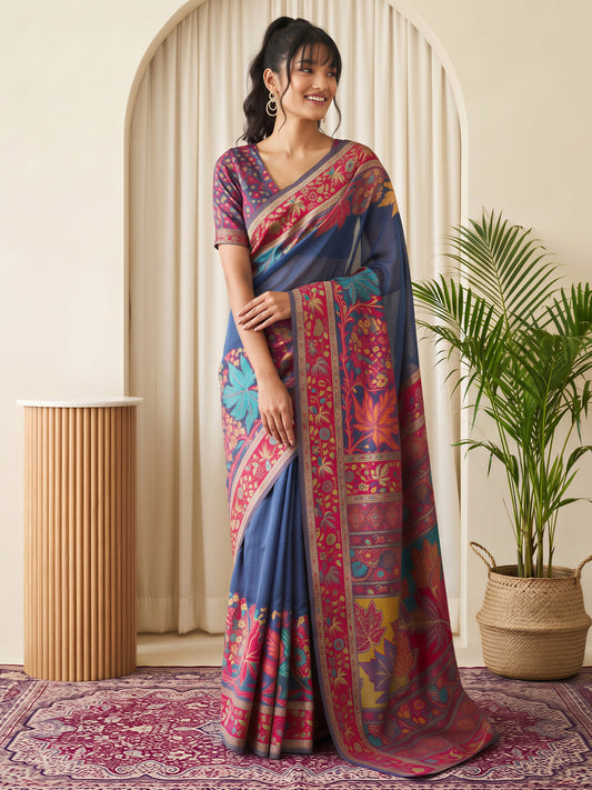 Woman wearing navy blue pashmina silk saree with traditional indian motif work and purple blouse