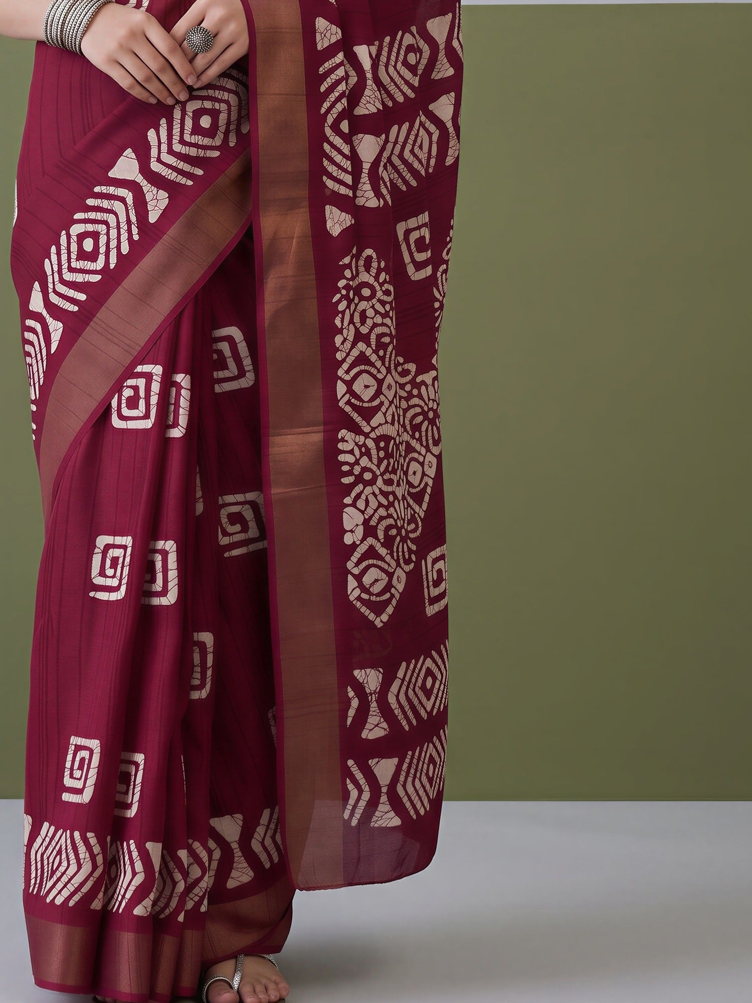 Pallu detail of magenta silk blend saree showing traditional indian motif work and zari border
