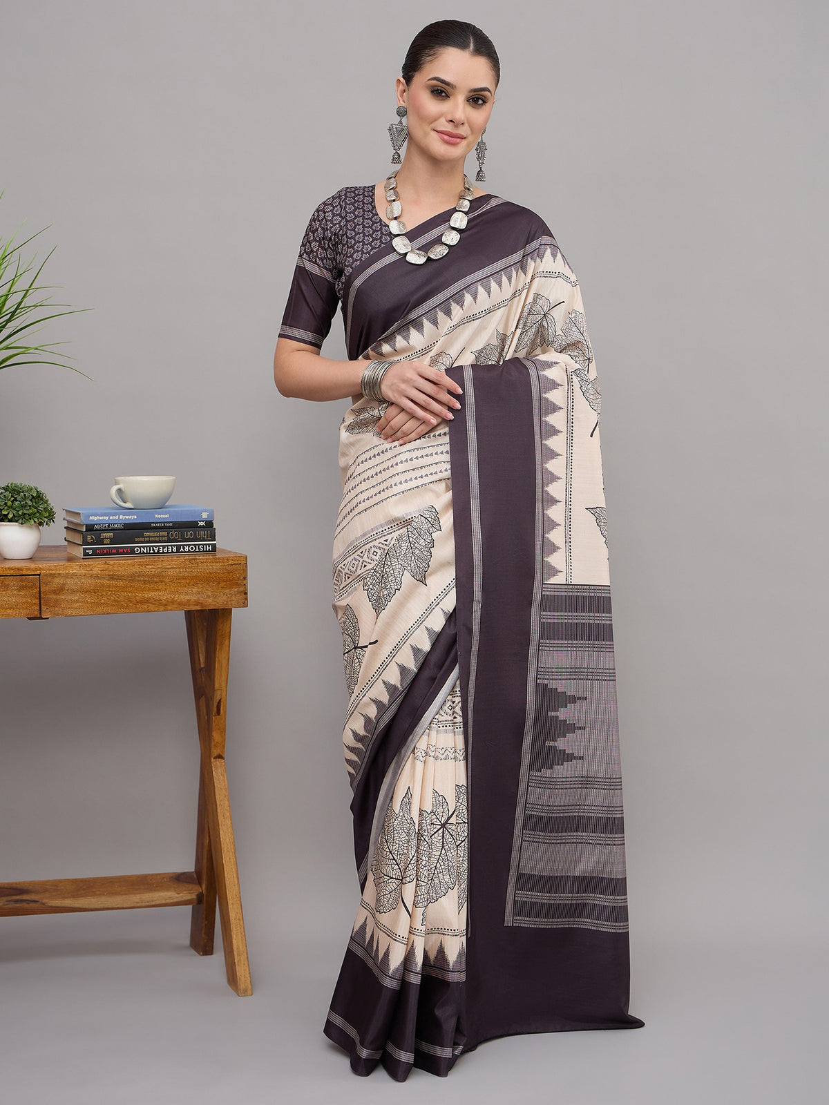 Off White ethnic motif soft silk saree with black blouse piece