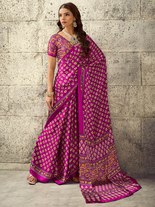 Woman wearing magenta satin saree with ajrak block-print motif work and magenta blouse