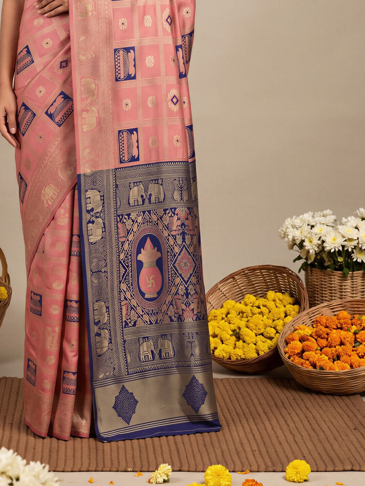 Pallu detail of peach litchi silk saree showing woven motif design and zari border