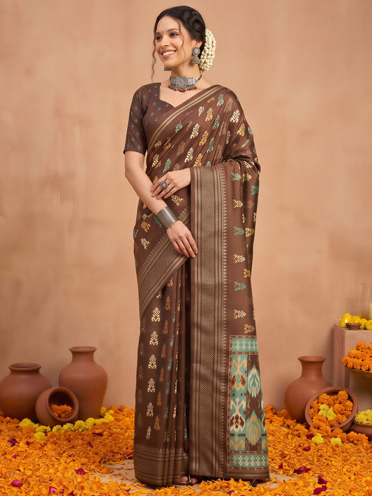 Woman wearing brown silk blend saree with metallic foil print work and brown blouse