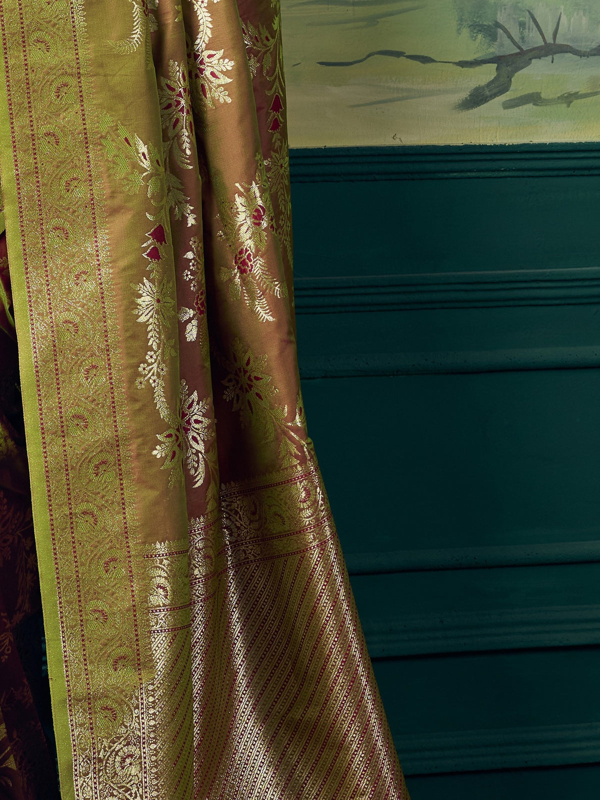 Pallu detail of olive banarasi silk saree showing woven motif design and zari border