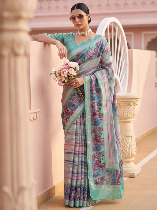 Woman wearing sea green jute silk saree with kalamkari narrative motif work and sea green blouse