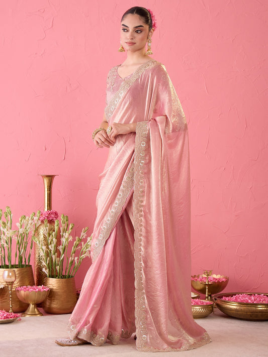 Woman wearing purple tissue ready to wear saree with ornamented surface design and purple blouse