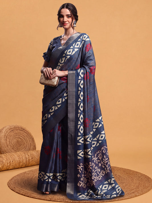 Woman wearing teal blue silk blend saree with hand block-printed motifs and teal blue blouse
