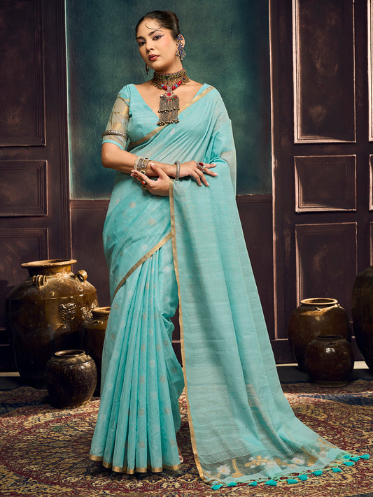 Woman wearing light blue muga cotton saree with zari butta (metallic motif) work and light blue blouse