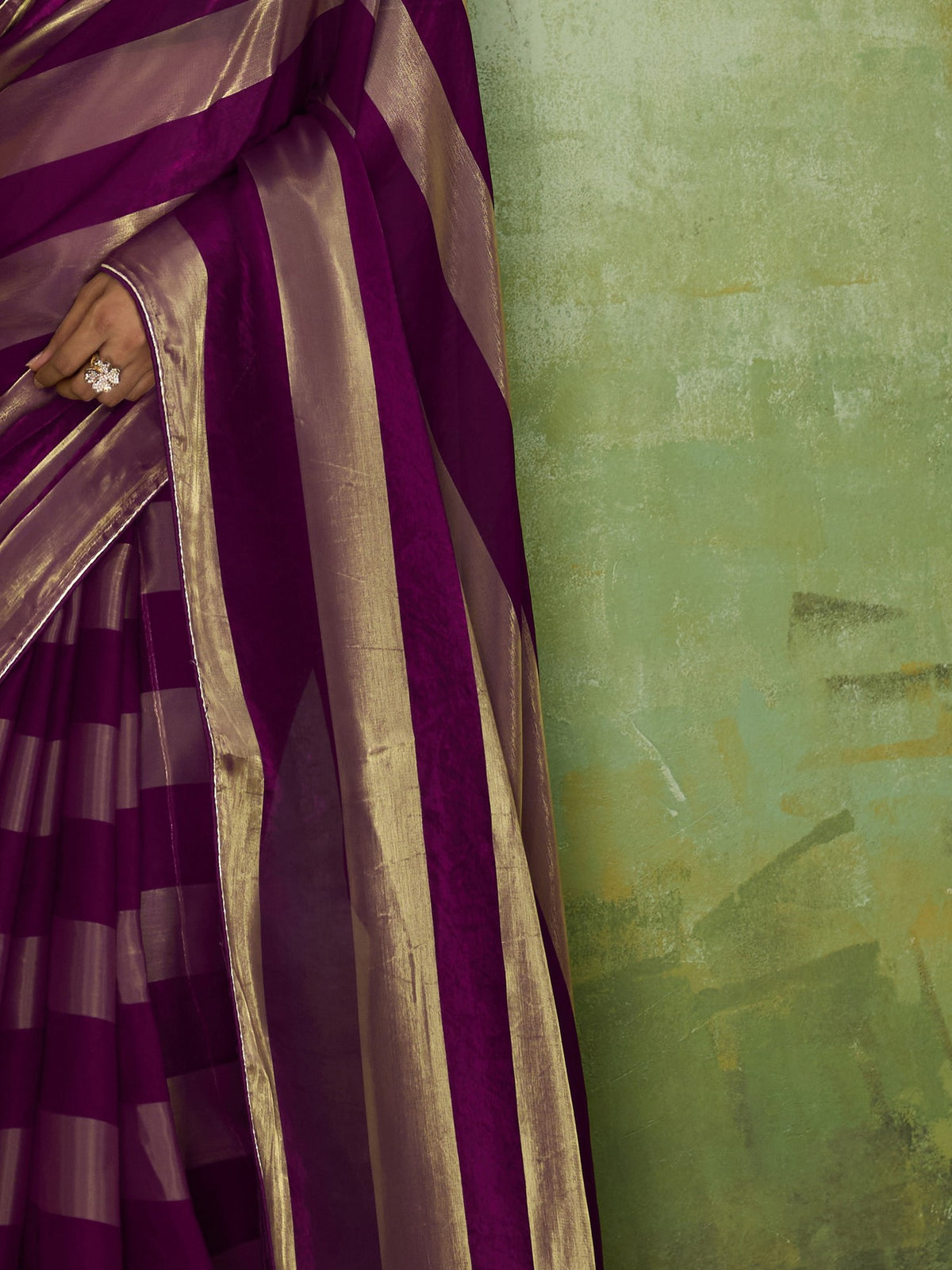 Pallu detail of violet satin silk saree showing colour-blocked design and zari border