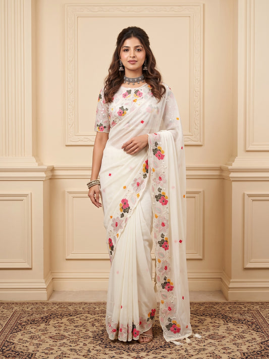 Woman wearing white georgette saree with embroidered motif work and white blouse