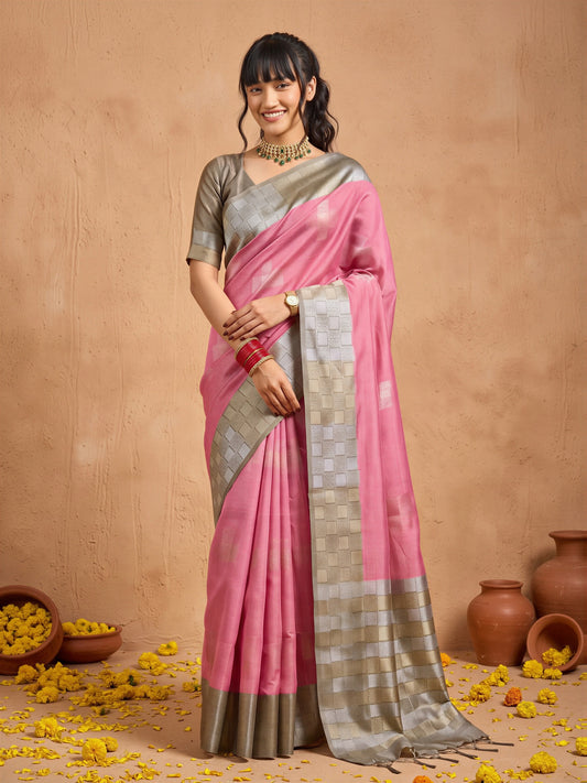 Woman wearing pink cotton blend saree with traditional indian motif work and silver blouse