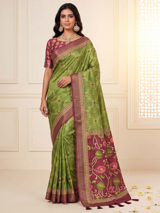Woman wearing light green silk blend saree with bandhani tie-dye dot work and brown blouse