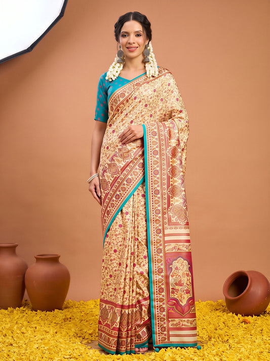 Woman wearing cream silk blend saree with metallic foil print work and teal blue blouse