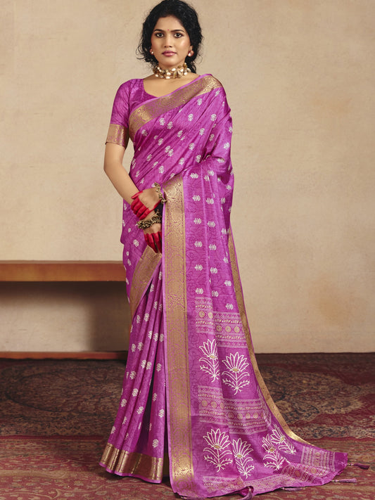 Woman wearing pink tussar silk saree with traditional indian motif work and pink blouse