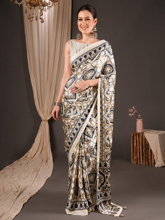 Woman wearing off white satin saree with ajrak block-print motif work and off white blouse