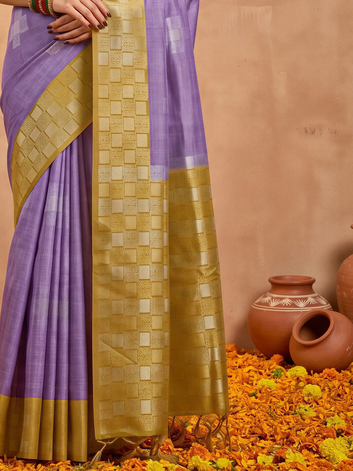 Pallu detail of mustard cotton blend saree showing traditional indian motif work and zari border
