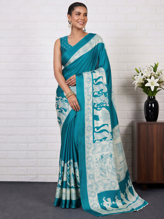 Woman wearing turquoise blue satin saree with kalamkari narrative motif work and turquoise blue blouse