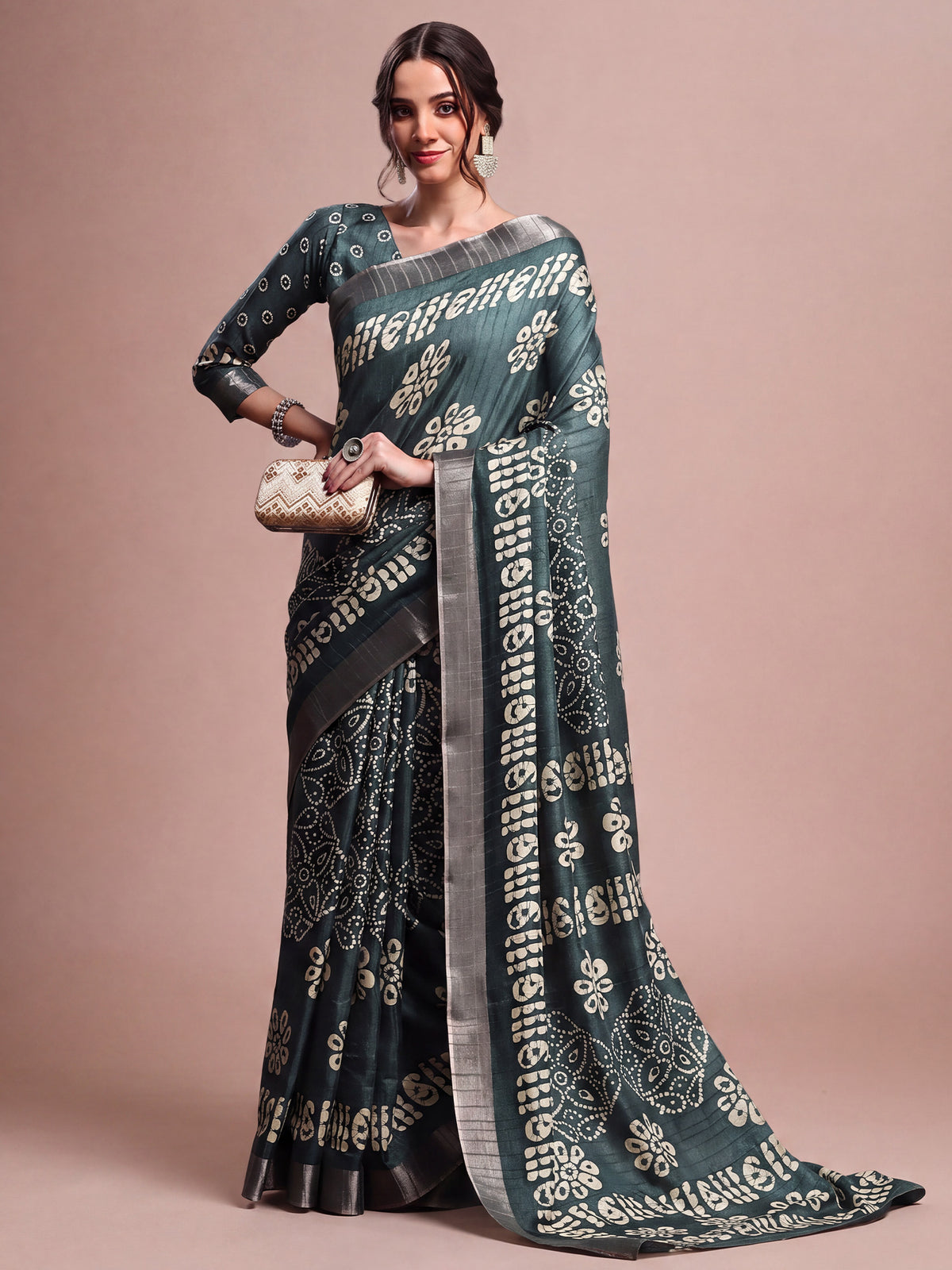 Woman wearing sea green silk blend saree with traditional indian motif work and sea green blouse