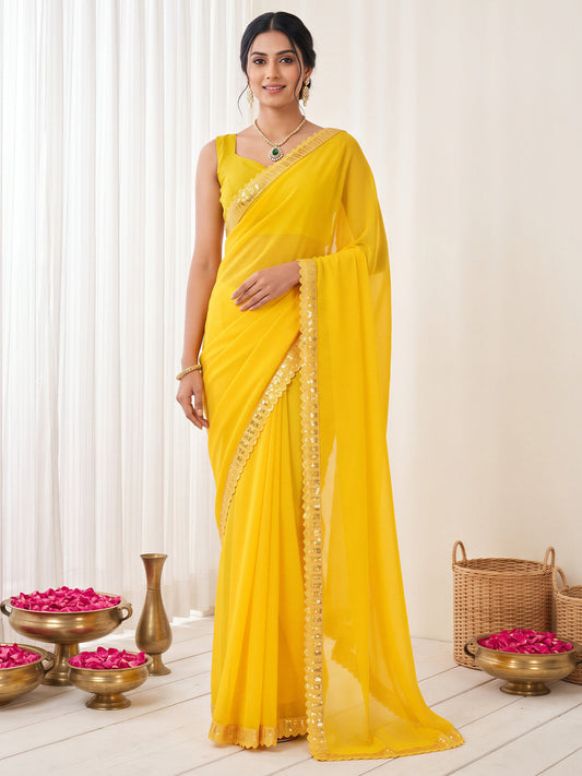 Woman wearing yellow georgette saree with clean solid-tone finish and yellow blouse
