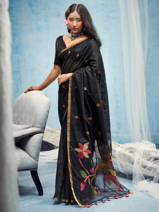 Woman wearing black muga cotton saree with embroidered motif work and black blouse