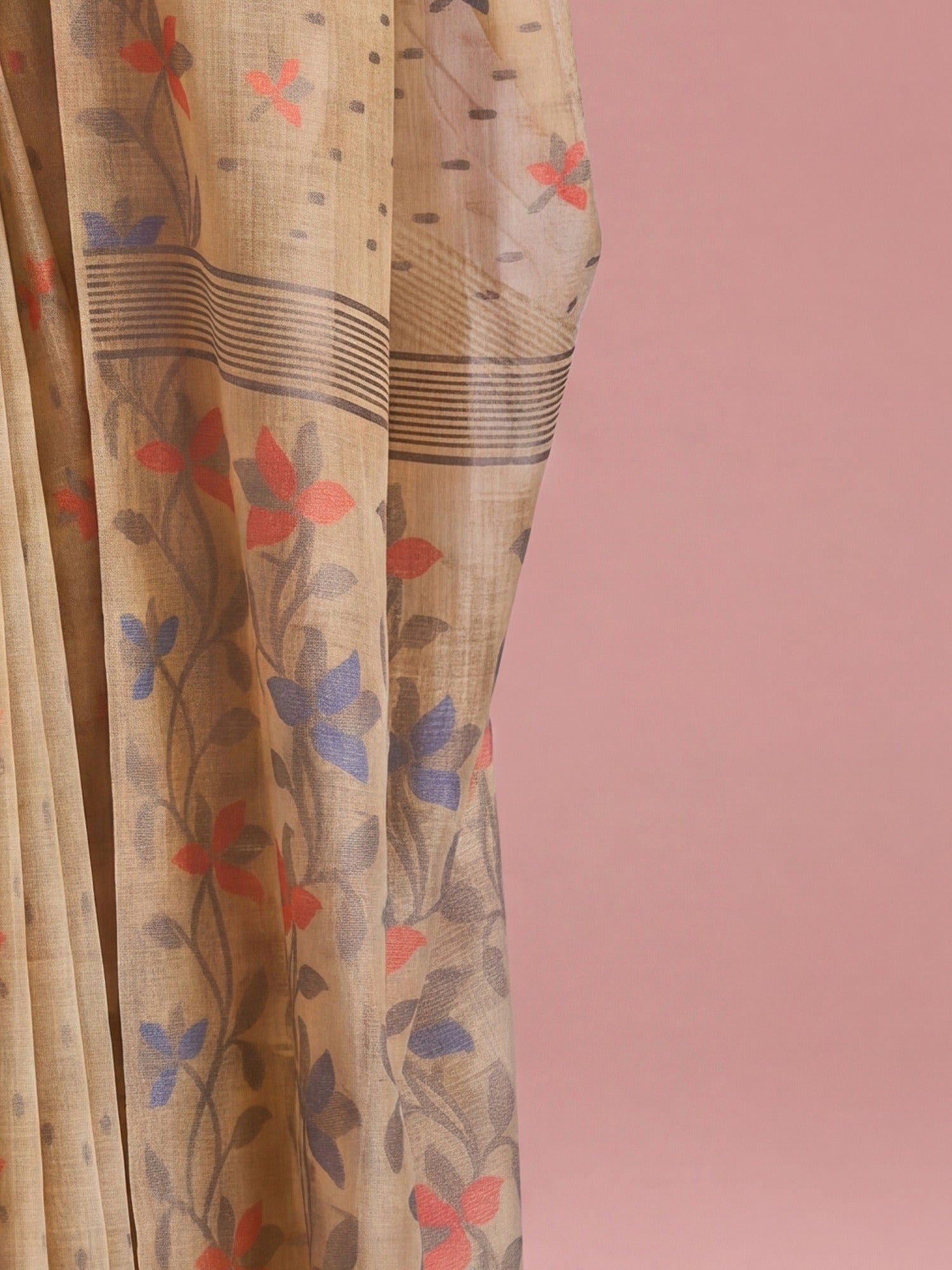 Pallu detail of beige linen saree showing all-over floral design and woven design border