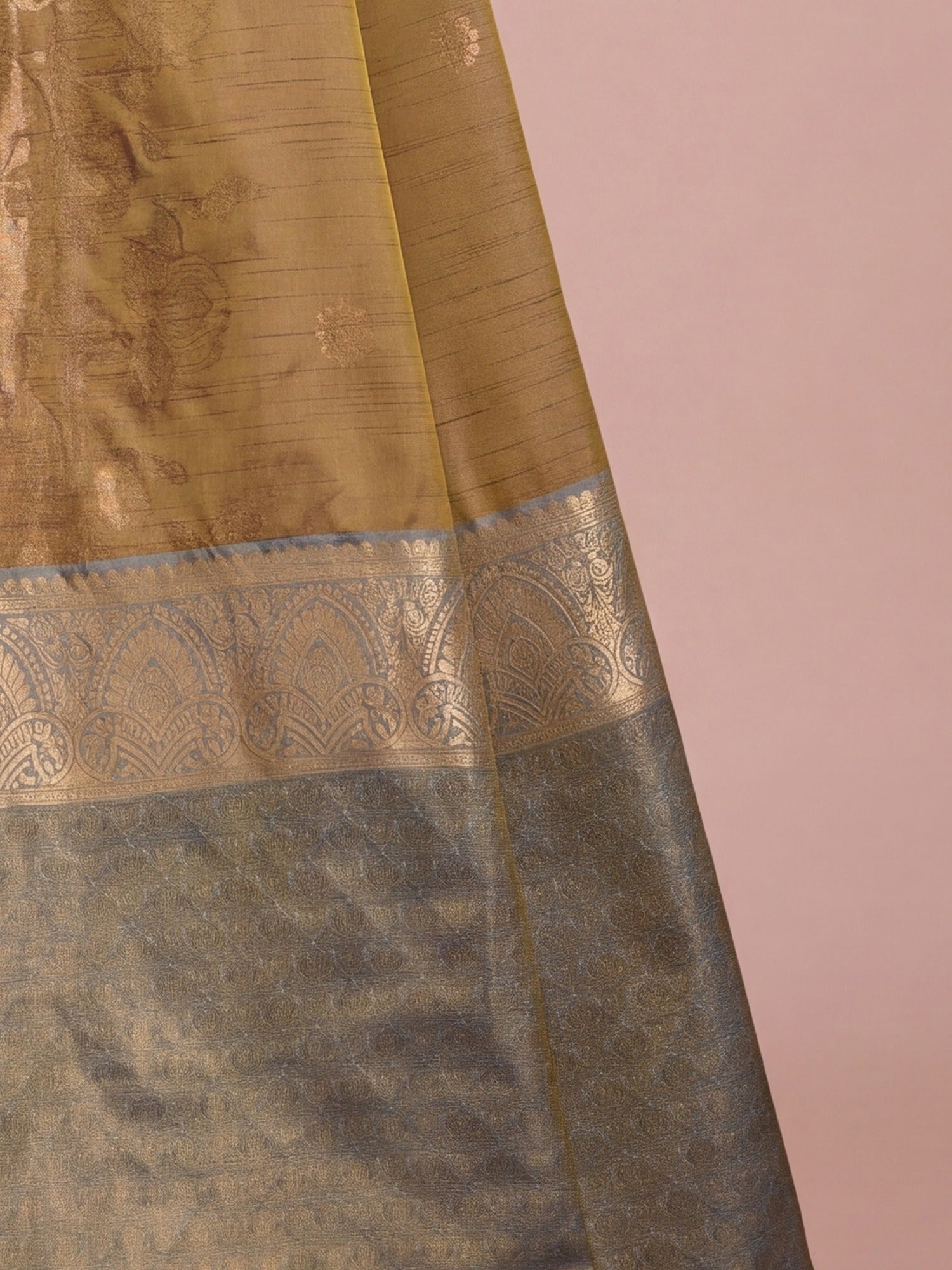 Pallu detail of mustard tussar silk saree showing traditional indian motif work and zari border
