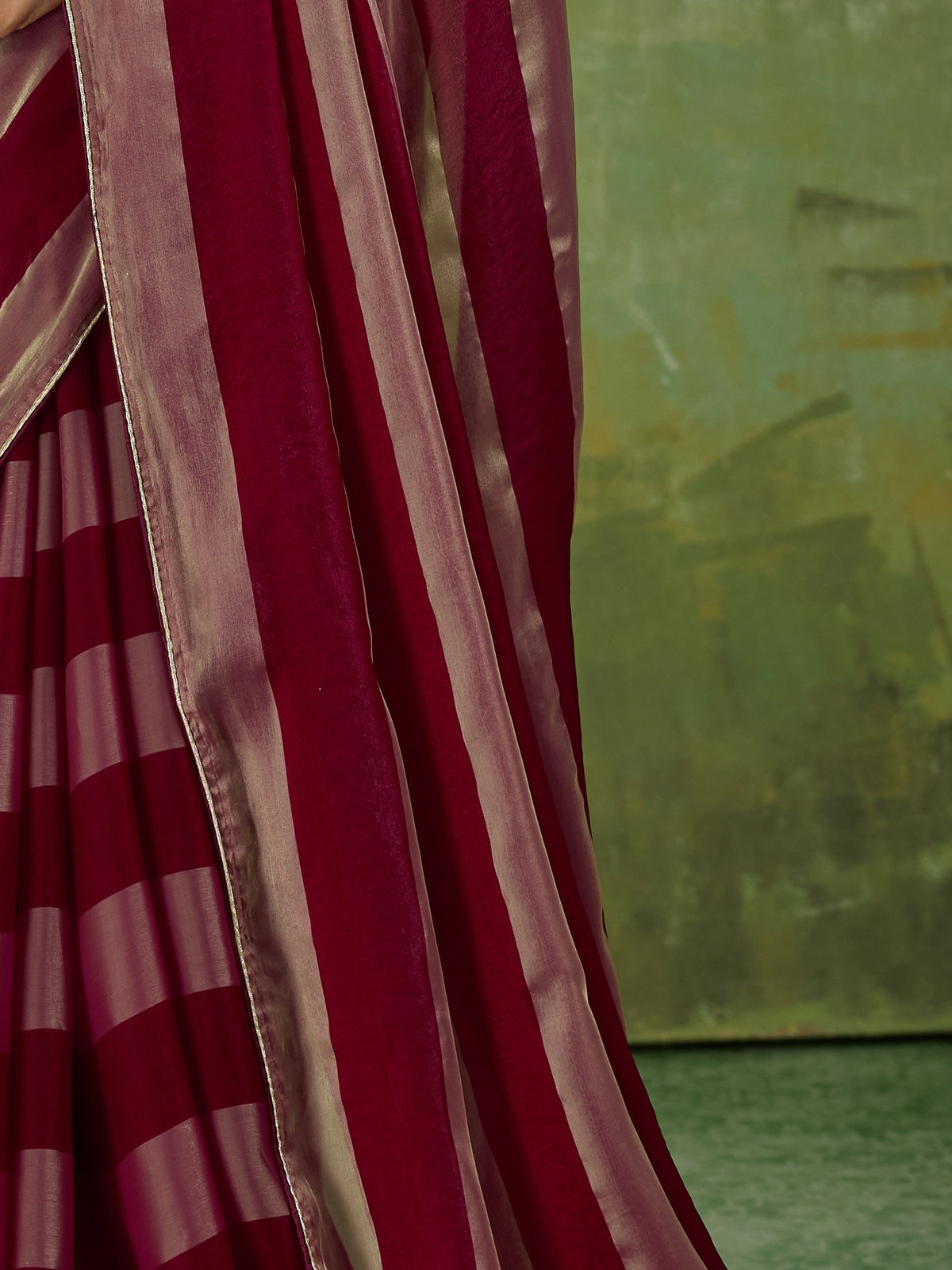 Pallu detail of wine satin silk saree showing colour-blocked design and zari border