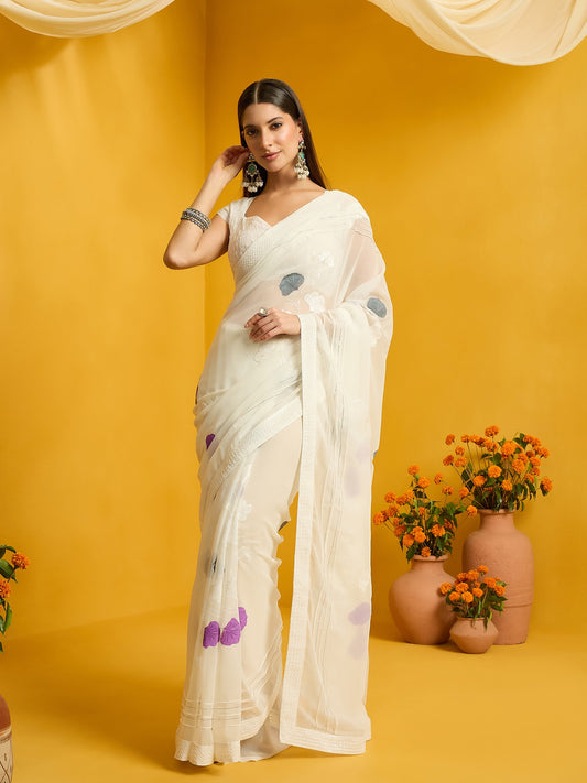 Woman wearing off white georgette saree with embroidered motif work and off white blouse