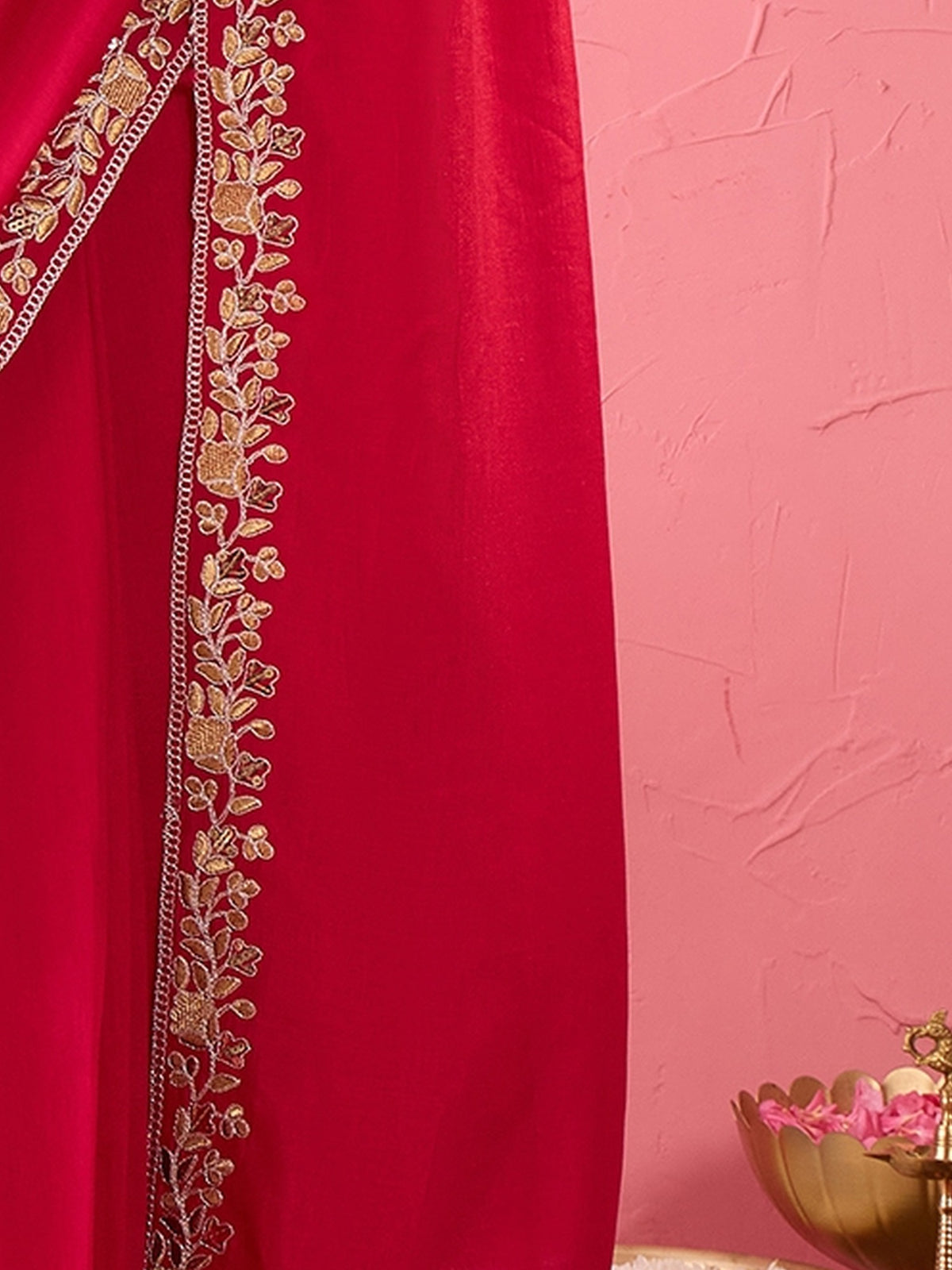 Pallu detail of pink vichitra silk saree showing ornamented surface design and embellished border