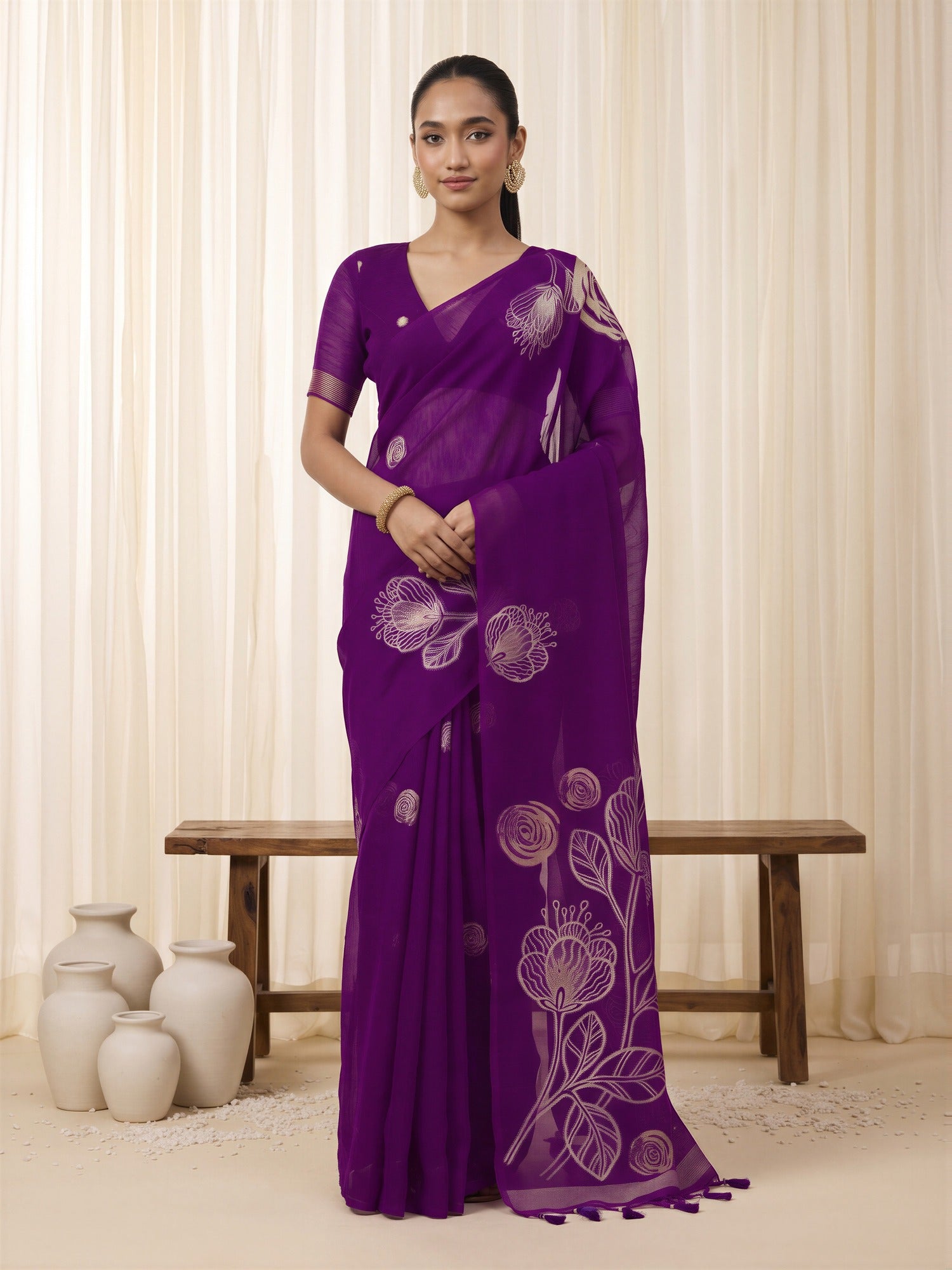Woman wearing purple pure silk saree with all-over floral design and purple blouse