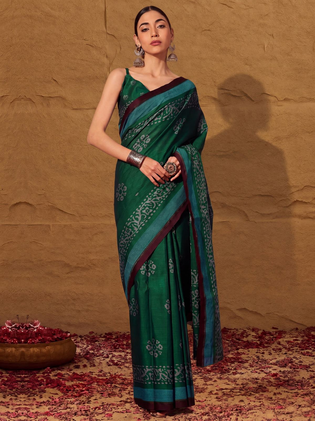 Woman wearing green cotton saree with batik wax-resist design and green blouse