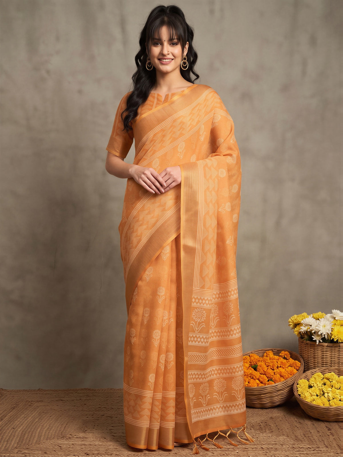 Woman wearing orange linen saree with bagh block-print motif work and orange blouse