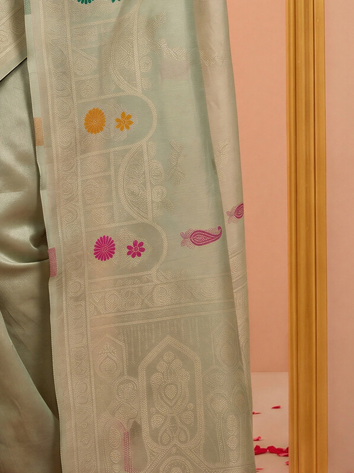 Pallu detail of sea green silk blend saree showing woven motif design and zari border