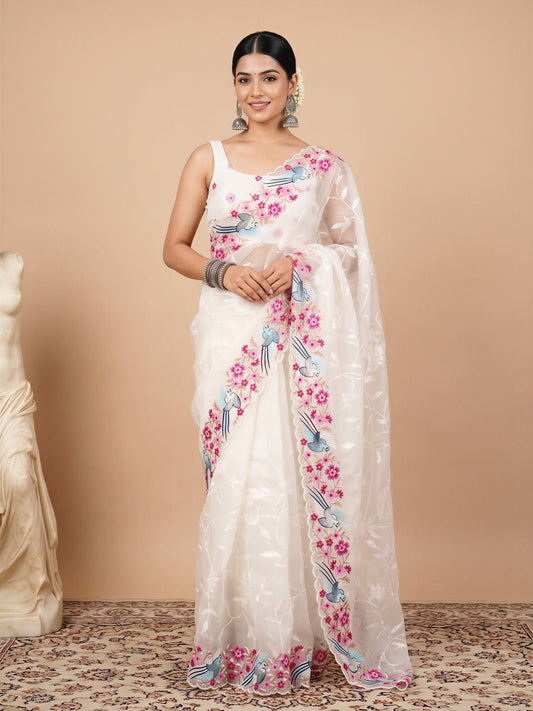 Woman wearing white organza saree with embroidered motif work and white blouse