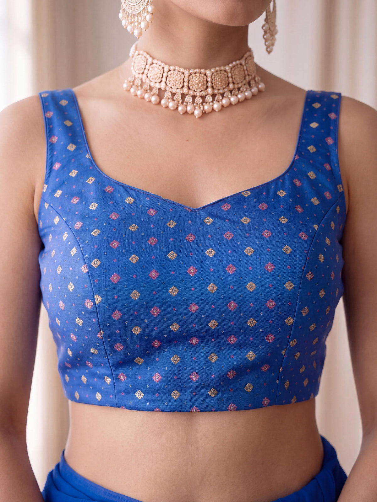 Turquoise Blue zari woven silk blend sleeveless readymade saree blouse with round neck view 1