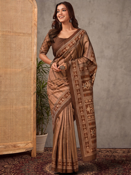 Woman wearing brown silk blend saree with striped pattern design and brown blouse