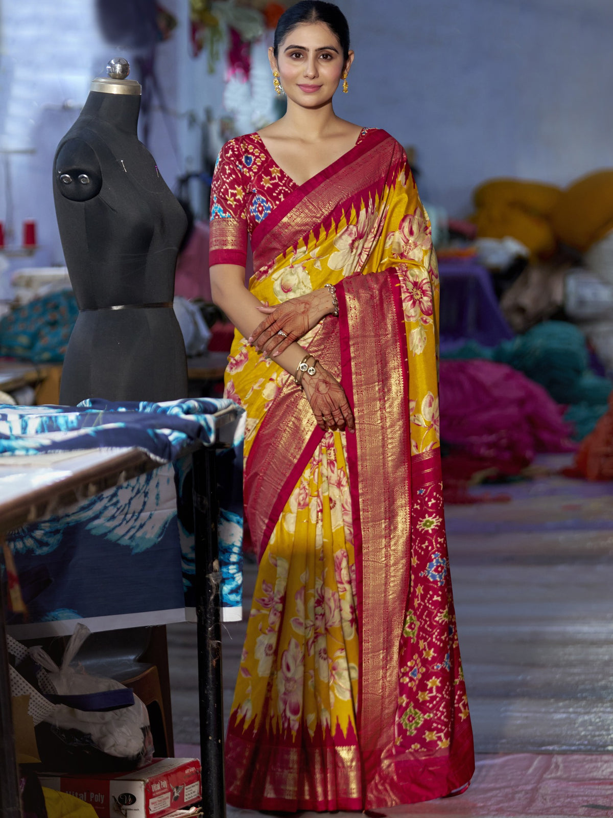 Woman wearing mustard tussar silk saree with ikat resist-dyed pattern and maroon blouse