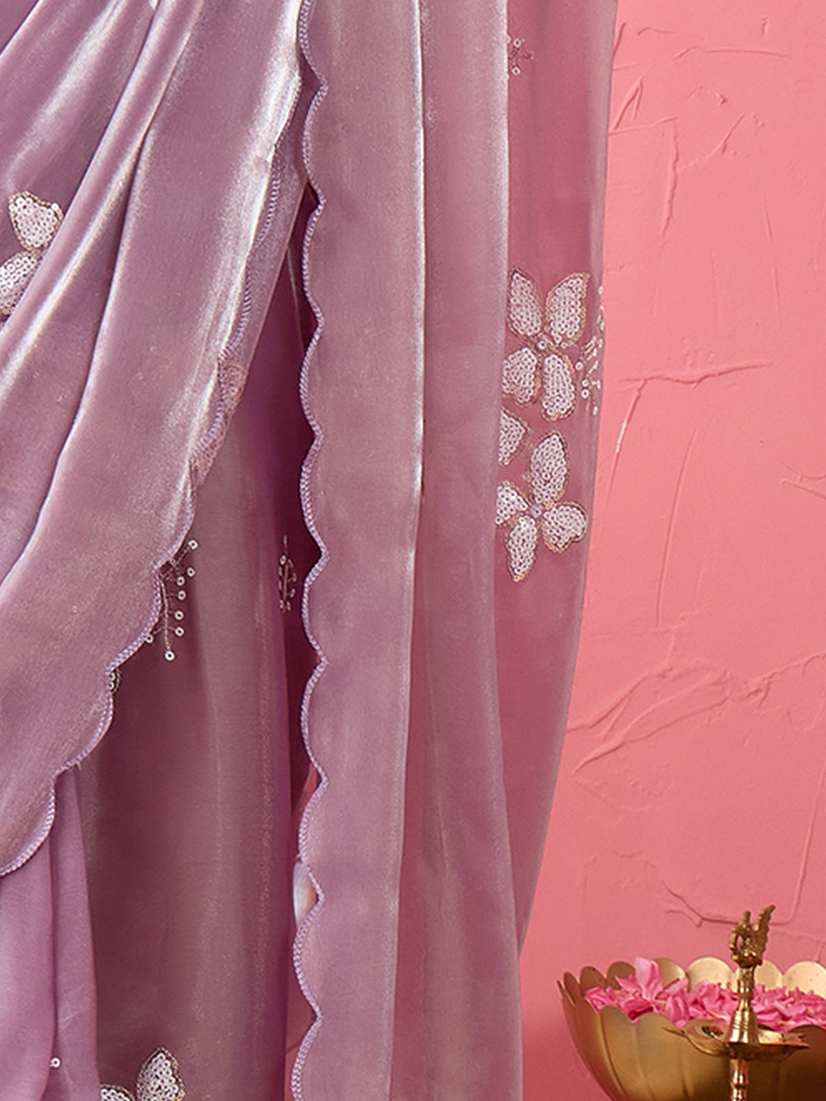 Pallu detail of lavender organza saree showing ornamented surface design and embroidered border