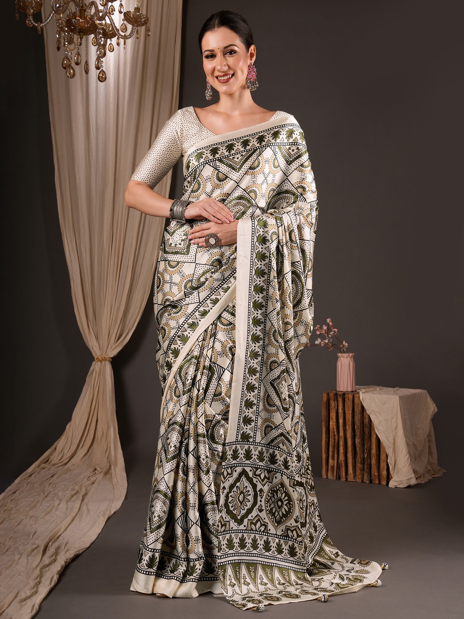 Woman wearing off white satin saree with ajrak block-print motif work and off white blouse