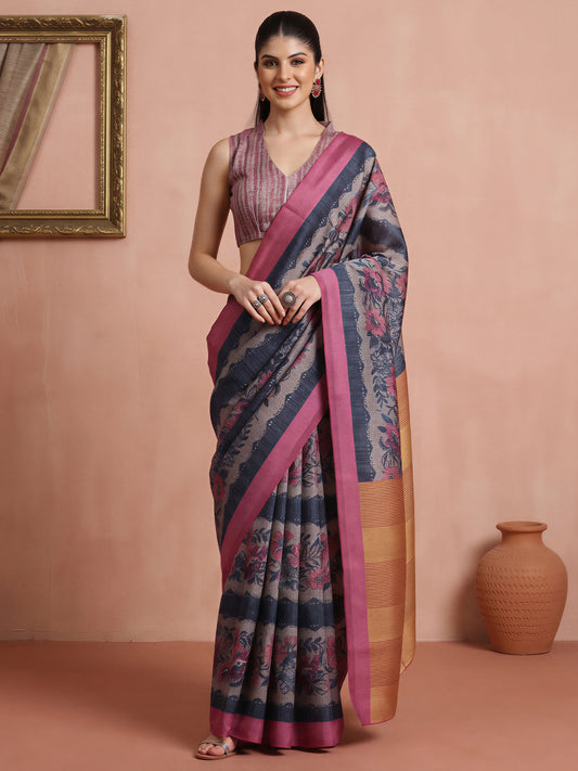Woman wearing grey cotton blend saree with all-over floral design and pink blouse