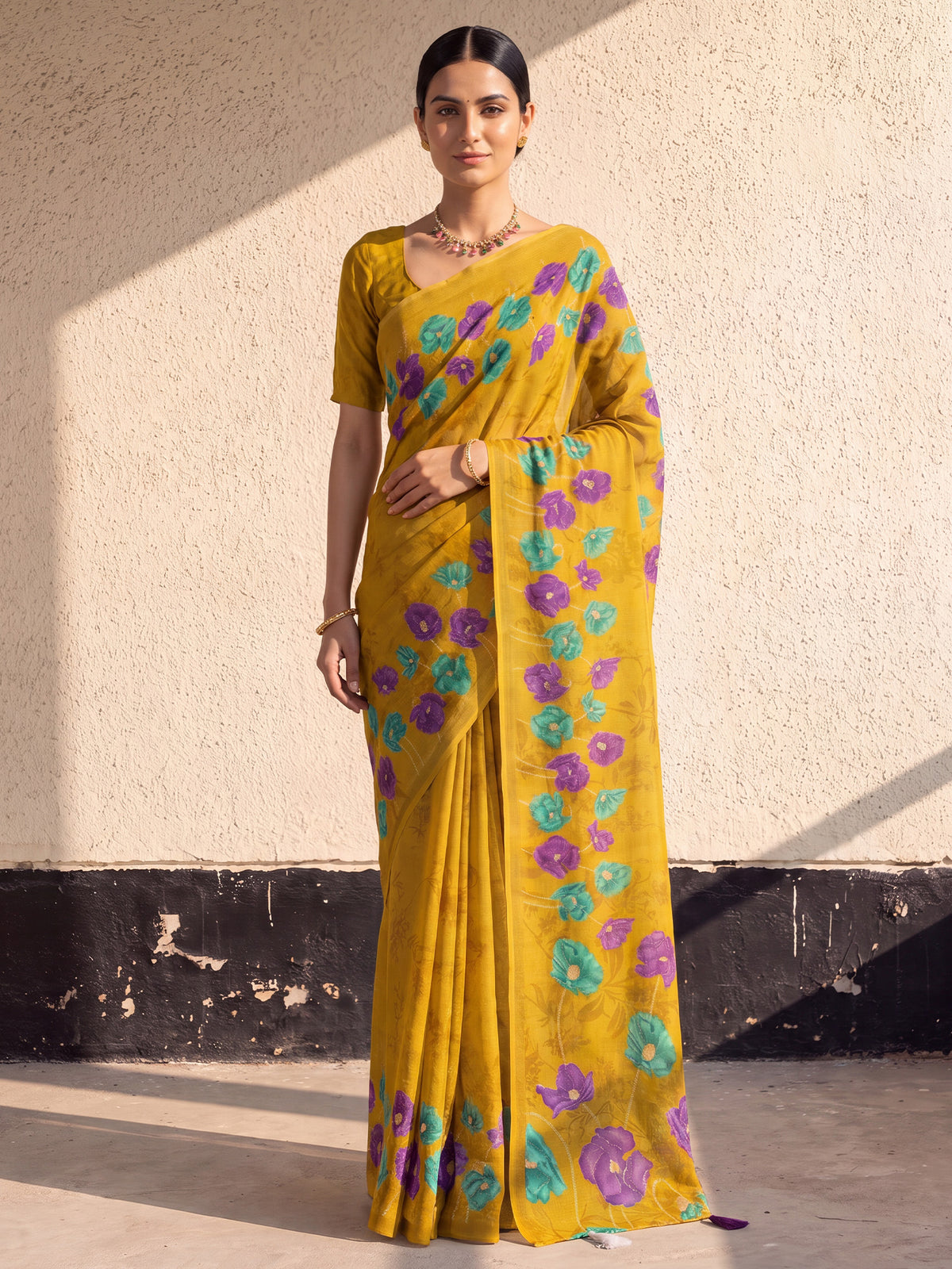 Woman wearing mustard cotton saree with all-over floral design and mustard blouse