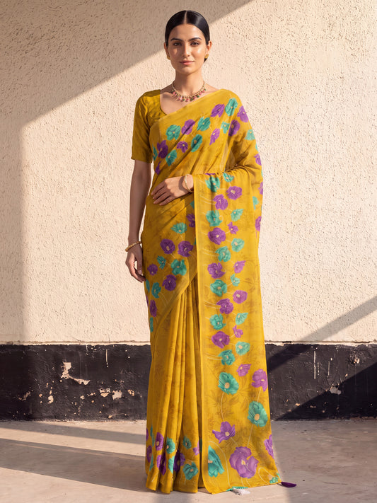 Woman wearing mustard cotton saree with all-over floral design and mustard blouse