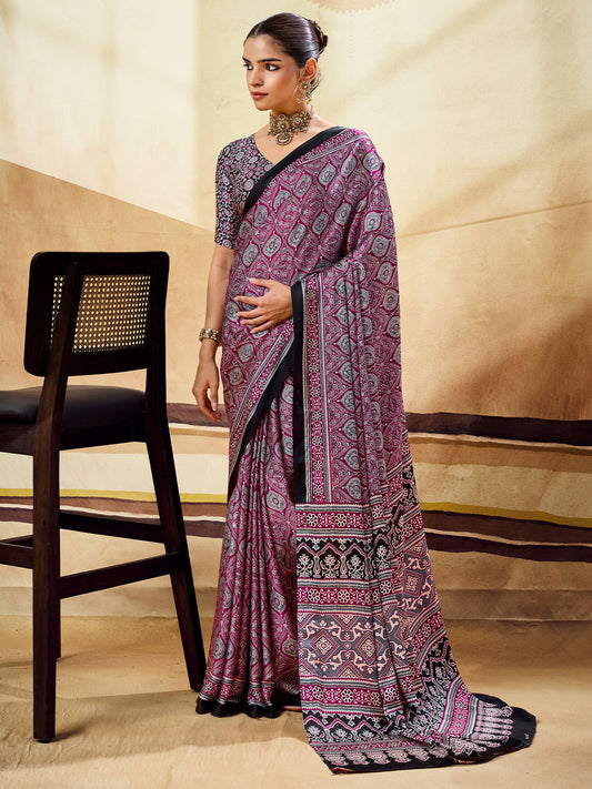 Woman wearing magenta satin saree with ajrak block-print motif work and black blouse