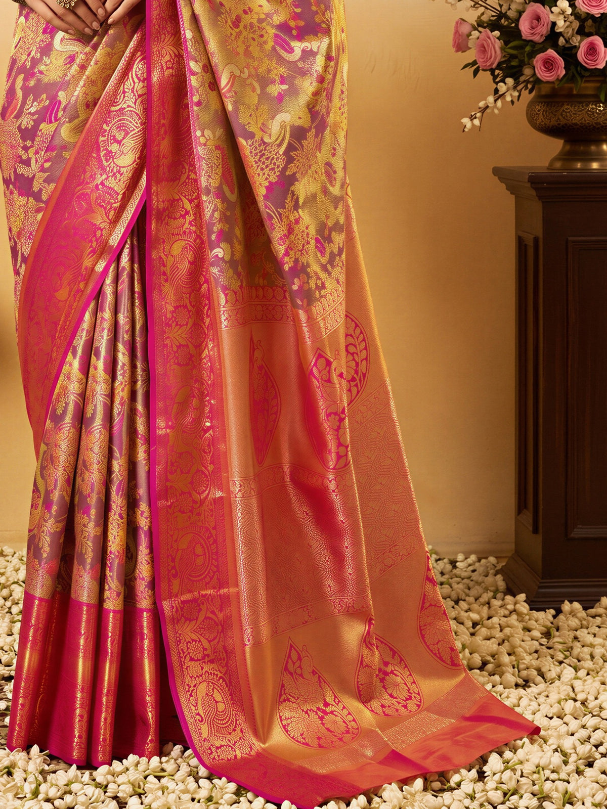 Pallu detail of pink silk blend saree showing traditional indian motif work and zari border