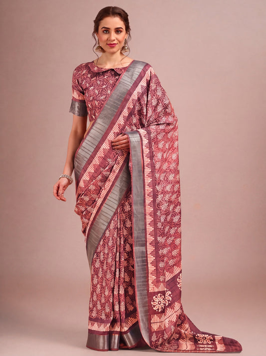 Woman wearing brown cotton silk saree with traditional indian motif work and brown blouse