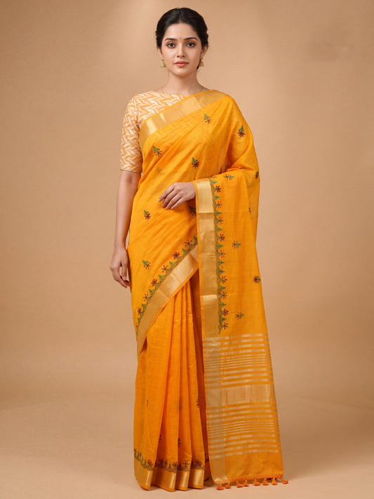Woman wearing mustard cotton linen saree with embroidered motif work and mustard blouse