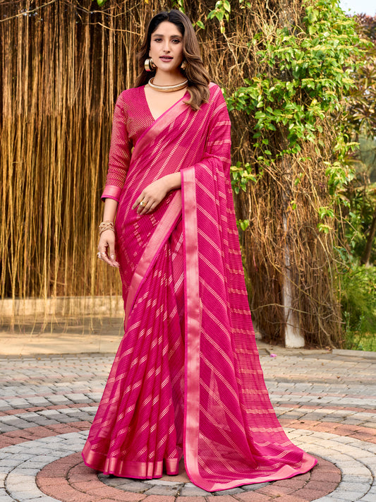 Woman wearing pink chiffon saree with metallic foil print work and pink blouse