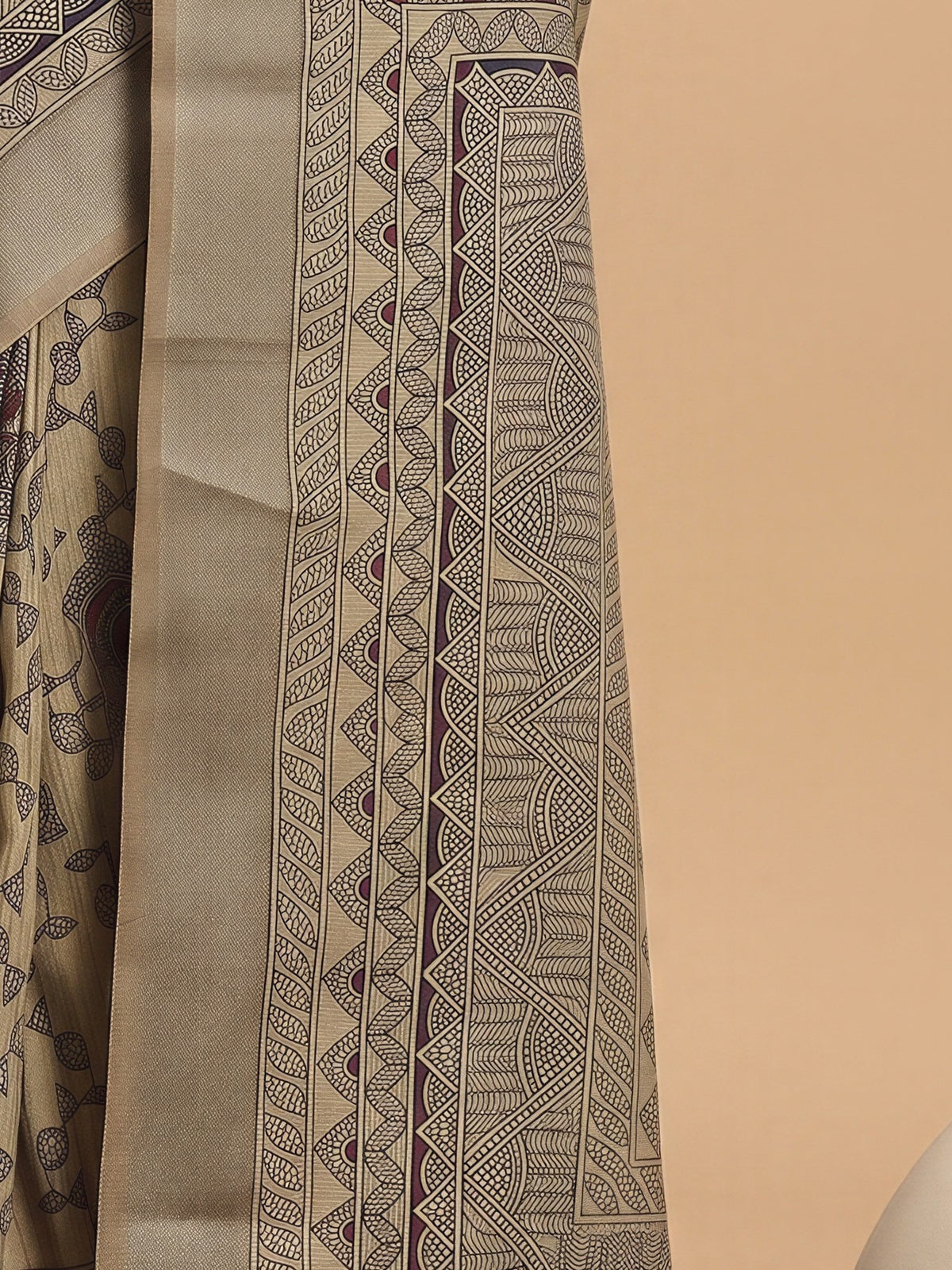 Pallu detail of cream satin silk saree showing hand block-printed motifs and zari border